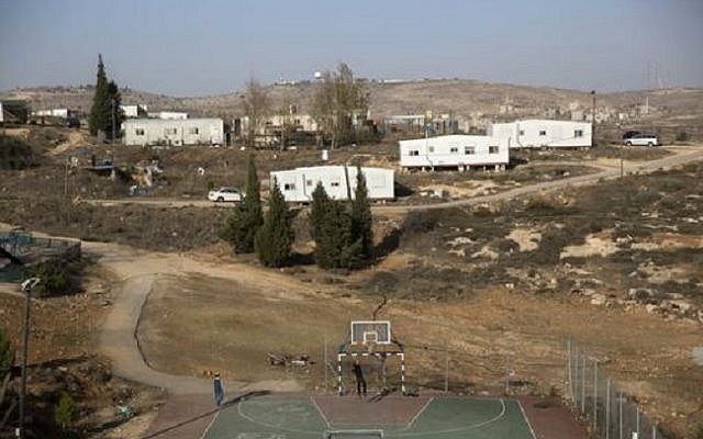 Young settlers play basketball in the illegal outpost of Amona on December 6, 2016. (AP Photo/Sebastian Scheiner)