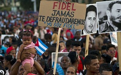 People wait for the beginning of a rally honoring Cuba's leader Fidel Castro before his burial Sunday at the Plaza Antonio Maceo in Santiago, Cuba, Saturday, December 3, 2016. (AP Photo/Ramon Espinosa) People wait for the beginning of a rally honoring Cuba's leader Fidel Castro before his burial Sunday at the Plaza Antonio Maceo in Santiago, Cuba, Saturday, December 3, 2016. (AP Photo/Ramon Espinosa)