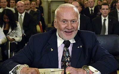 In this Tuesday, Feb. 24, 2015, file photo, Buzz Aldrin, former NASA Astronaut and Apollo 11 Pilot, prepares to testify on Capitol Hill in Washington, before the Senate subcommittee on Space, Science, and Competitiveness hearing on human exploration goals and commercial space competitiveness. (AP/Susan Walsh)