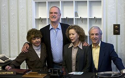 In this Wednesday, May 6, 2009 file photo, the cast of TV comedy series Fawlty Towers, from left, Prunella Scales, John Cleese, Connie Booth and Andrew Sachs reunite to celebrate the 30th anniversary of the TV show. (AP Photo/ Edmond Terakopian, file)