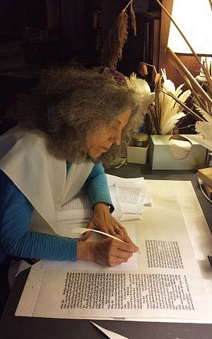 Rabbi Linda Motzkin of Temple Sinai in Saratoga Springs, NY., scribes a section of the Community Torah Project. (Courtesy Rabbi Linda Motzkin)