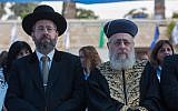 Chief Sephardi Rabbi Yitzhak Yosef, right, and Ashkenazi Chief Rabbi David Lau attend a New Year's ceremony of the Israel Police Command at the National Headquarters of the Israel Police in Jerusalem on September 7, 2015. (Yonatan Sindel/Flash90)