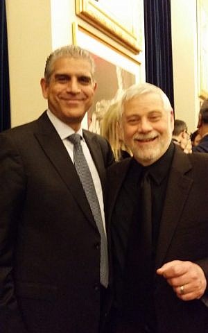Author Edwin Black, right, poses for a selfie with PLO envoy Maen Areikat at a Hanukkah party at the Trump International Hotel in Washington, D.C., Dec. 14, 2016. (Courtesy of Edwin Black, via JTA)