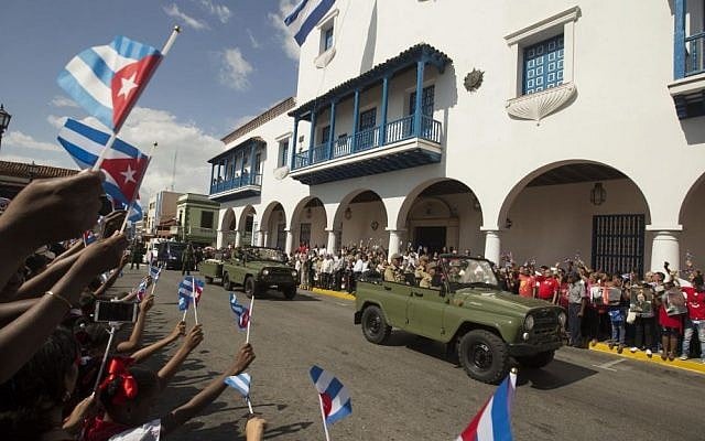 The caravan driving the ashes of Cuba's leader Fidel Castro arrives at the Cespedes Park in Santiago, Cuba, Saturday, December 3, 2016. (AP Photo/Ricardo Mazalan)