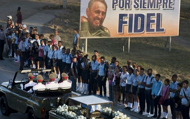 The motorcade carrying the ashes of the late Cuban leader Fidel Castro makes its final journey towards the Santa Ifigenia cemetery in Santiago, Cuba, on Sunday, December 4, 2016. (AP Photo/Ramon Espinosa) The motorcade carrying the ashes of the late Cuban leader Fidel Castro makes its final journey towards the Santa Ifigenia cemetery in Santiago, Cuba, on Sunday, December 4, 2016. (AP Photo/Ramon Espinosa)