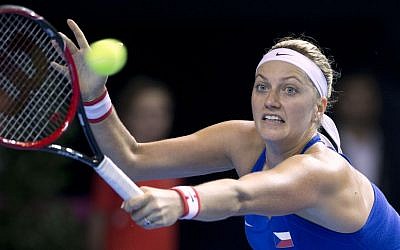In this Nov. 12, 2016 file picture Czech Republic's Petra Kvitova returns the ball to France's Caroline Garcia during the Fed Cup final in Strasbourg, France. Kvitova has been injured during an attack in her flat in the Czech Republic. (AP Photo/Jean-Francois Badias,file)