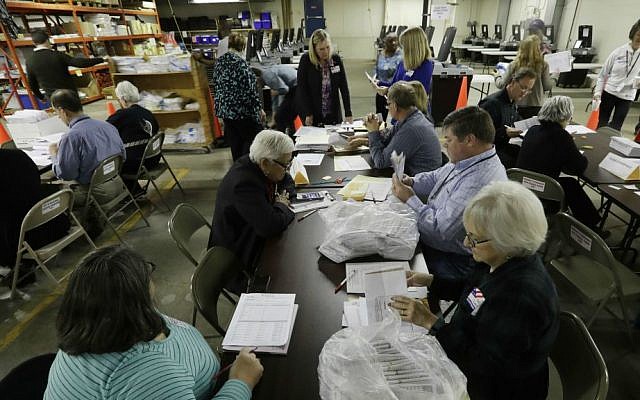 Workers begin a statewide presidential election recount Thursday, Dec. 1, 2016, in Milwaukee, Wisconsin. (AP Photo/Morry Gash)