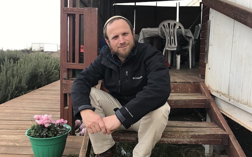 Eli Greenberg sitting outside his home in the West Bank outpost of Amona, Dec. 13, 2016. (Andrew Tobin/JTA) Eli Greenberg sitting outside his home in the West Bank outpost of Amona, Dec. 13, 2016. (Andrew Tobin/JTA)