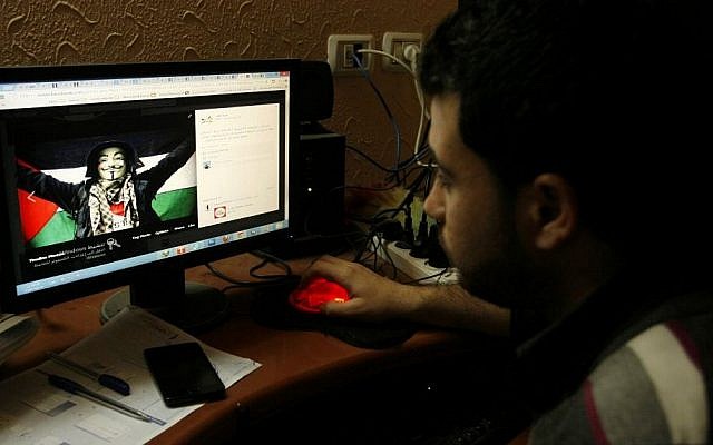 Illustrative photo of a Palestinian man looking at an anti-Israel Facebook page. April 07, 2013. (Abed Rahim Khatib/Flash90) Illustrative photo of a Palestinian man looking at an anti-Israel Facebook page. April 07, 2013. (Abed Rahim Khatib/Flash90)