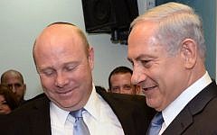 Prime Minister Benjamin Netanyahu with his former chief of staff, Gil Sheffer, during a goodbye party for Sheffer at the Prime Minister Office in Jerusalem, March 9, 2014. (Kobi Gideon/GPO/Flash90)