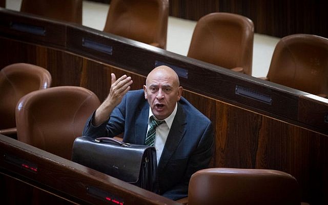 Basel Ghattas reacts during a plenum session in the Knesset on July 7, 2015. (Miriam Alster/FLASH90)