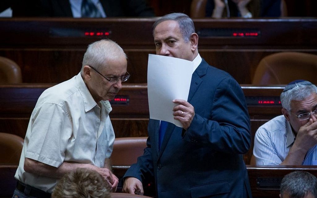 Prime Minister Benjamin Netanyahu speaks with Likud MK Benny Begin during a plenum session in the Knesset, August 1, 2016. (Yonatan Sindel/Flash90)