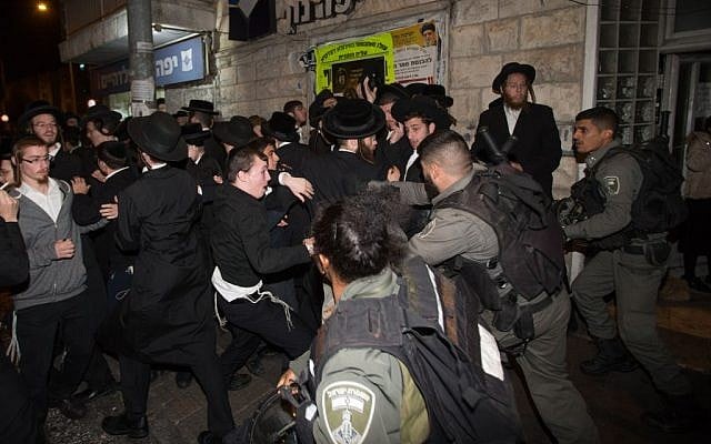 Ultra-Orthodox demonstrators protest at the Bar Ilan intersection in Jerusalem on November 6, 2016, following the arrest of an ultra-orthodox draft-dodger. (Yonatan Sindel/Flash90)