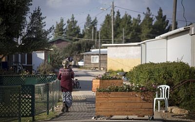 Jewish residents of the unauthorized Israeli outpost of Amona, in the West Bank, seen walking on the streets of the settlement on November 17, 2016. (Miriam Alster/Flash90) Jewish residents of the unauthorized Israeli outpost of Amona, in the West Bank, seen walking on the streets of the settlement on November 17, 2016. (Miriam Alster/Flash90)
