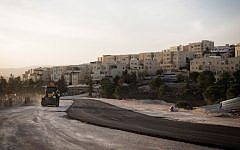 Sunset over a construction site next to the Jewish East Jerusalem neighborhood of Ramat Shlomo on November 21, 2016. (Sebi Berens/Flash90)