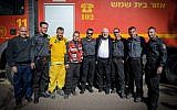 Israeli president Reuven Rivlin meets with firefighters in Nataf, outside of Jerusalem, which was damaged in a major fire in November 2016. (Mark Neyman/GPO)