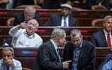 Prime Minister Benjamin Netanyahu, left, speaks with Tourism Minister Yariv Levin in the Knesset, December 7, 2016. (Hadas Parush/Flash90)