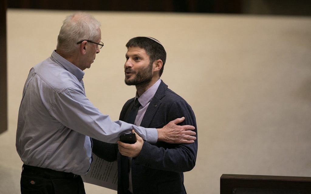 Jewish Home MK Bezalel Smotrich, right, speaks with Likud MK Benny Begin during a vote on the so-called Regulation Bill on December 7, 2016. (Yonatan Sindel/Flash90)