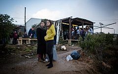 Young Jewish settlers react to the news that the residents of the illegal outpost of Amona had accepted a government proposal to peacefully evacuate the outpost and move to a nearby location on December 18, 2016 (Miriam Alster/Flash90)