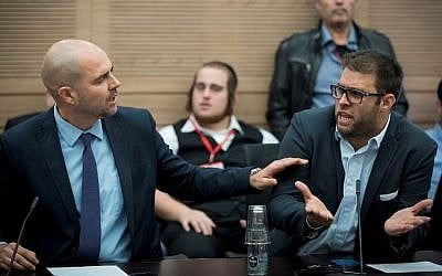 Likud MKs Amir Ohana (L) and Oren Hazan attend a Knesset Committee meeting discussing the allegations against Joint (Arab) List member Basel Ghattas in Jerusalem on December 20, 2016. (Yonatan Sindel/Flash90)