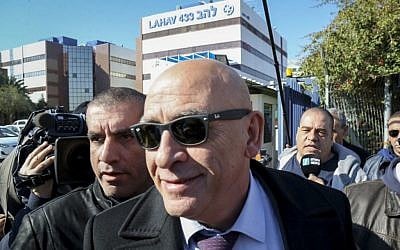 Joint Arab List member Basel Ghattas arrives at the Lahav 433 investigation unit in Lod, December 20, 2016. Ghattas is suspected of smuggling cell phones to Palestinian security prisoners last week. (Flash90) Joint Arab List member Basel Ghattas arrives at the Lahav 433 investigation unit in Lod, December 20, 2016. Ghattas is suspected of smuggling cell phones to Palestinian security prisoners last week. (Flash90)
