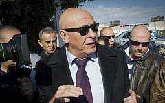 MK Basel Ghattas arrives at the Israel Police's Lahav 433 special investigation unit in Lod, December 20, 2016, for questioning. (Roy Alima/Flash90)