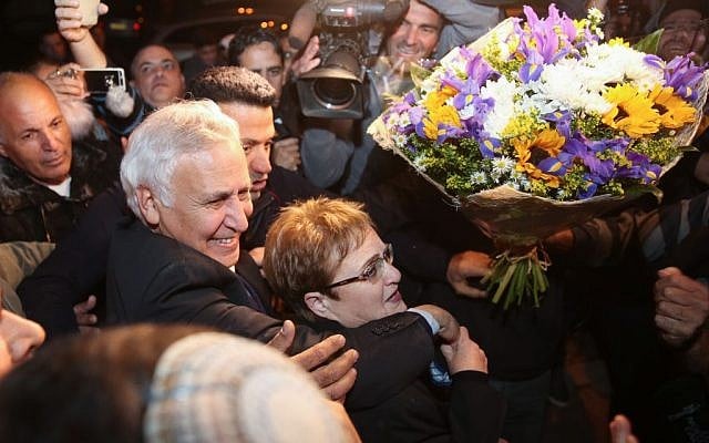 Former president Moshe Katsav, accompanied by his wife Gila, arrives in his hometown of Kiryat Malachi on December 21, 2016, after his release from prison where he served five years of a seven-year rape sentence (Photo by Hadas Parush/Flash90)