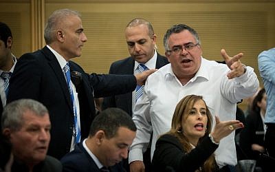 MK David Bitan is taken out by security guards during a Knesset Committee meeting discussing the allegations against Joint (Arab) List MK Basel Ghattas, September 21, 2016. (Yonatan Sindel/Flash90