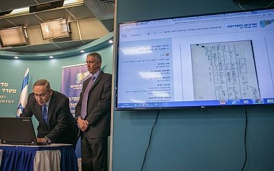 Prime Minister Benjamin Netanyahu during a press conference inaugurating the State archive on the "Yemenite Children Affair," now open to the public online, at the Prime Minister's Office in Jerusalem on December 28, 2016. Alongside him is state archivist Yaakov Lozowick. Families from Yemenite and North African Jewish communities maintain the Israeli government systematically kidnapped their children from Israeli hospitals and put them up for adoption during the immigration wave in the 1950s. (Ohad Zwigenberg/POOL)