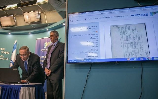 Prime Minister Benjamin Netanyahu during a press conference inaugurating the State archive on the "Yemenite Children Affair," now open to the public online, at the Prime Minister's Office in Jerusalem on December 28, 2016. Alongside him is state archivist Yaakov Lozowick. Families from Yemenite and North African Jewish communities maintain the Israeli government systematically kidnapped their children from Israeli hospitals and put them up for adoption during the immigration wave in the 1950s. (Ohad Zwigenberg/POOL) Prime Minister Benjamin Netanyahu during a press conference inaugurating the State archive on the "Yemenite Children Affair," now open to the public online, at the Prime Minister's Office in Jerusalem on December 28, 2016. Alongside him is state archivist Yaakov Lozowick. Families from Yemenite and North African Jewish communities maintain the Israeli government systematically kidnapped their children from Israeli hospitals and put them up for adoption during the immigration wave in the 1950s. (Ohad Zwigenberg/POOL)