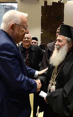 President Reuven Rivlin speaks with Greek Orthodox Patriarch of Jerusalem Theophilos III at his residence in Jerusalem in honor of the upcoming New Year, on December 27, 2016. (Mark Neiman/GPO)