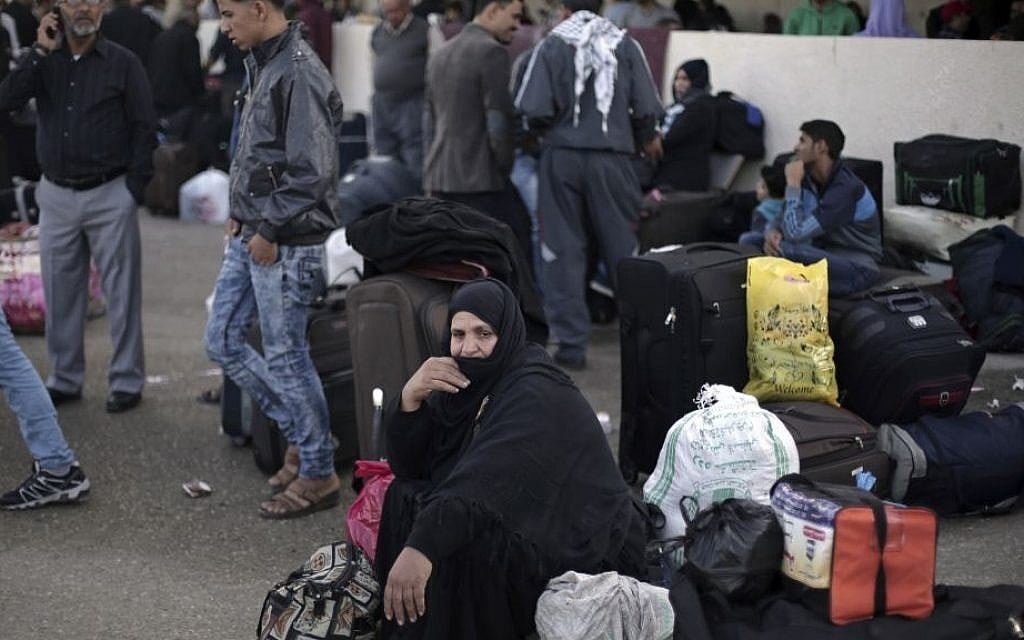 Illustrative photo of Palestinian woman who sits next to her luggage as she waits to cross to the Egyptian side of the Rafah border crossing, in Rafah, Gaza Strip, October 19, 2016. (AP Photo/Adel Hana, File) Illustrative photo of Palestinian woman who sits next to her luggage as she waits to cross to the Egyptian side of the Rafah border crossing, in Rafah, Gaza Strip, October 19, 2016. (AP Photo/Adel Hana, File)