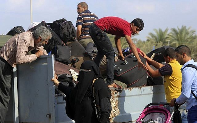 Palestinians put their luggage on a cart to cross the border to Egypt, in Rafah, Gaza Strip, October 19, 2016. (AP Photo/Adel Hana, File) Palestinians put their luggage on a cart to cross the border to Egypt, in Rafah, Gaza Strip, October 19, 2016. (AP Photo/Adel Hana, File)
