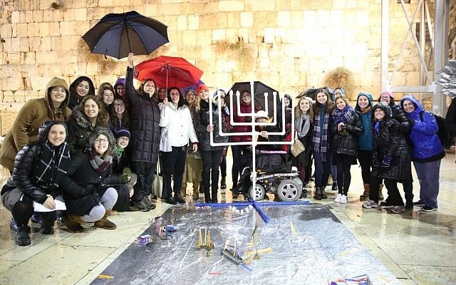 Women of the Wall light Hanukkah candles at the Western Wall, 27 December, 2016 (Miri Tzach/Women of the Wall) Women of the Wall light Hanukkah candles at the Western Wall, 27 December, 2016 (Miri Tzach/Women of the Wall)