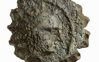 The visage of Antiochus on the observe of a bronze coin found at the Tower of David Citadel courtyard (Courtesy Tower of David)