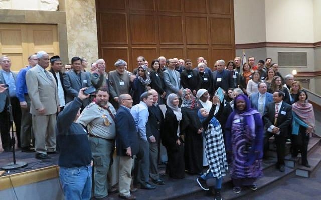 Imams, rabbis, and Jewish and Muslim lay leaders posing for a group photo at Congregation Tifereth Israel in Washington, D.C., Dec. 11, 2016. (Ron Kampeas/JTA)