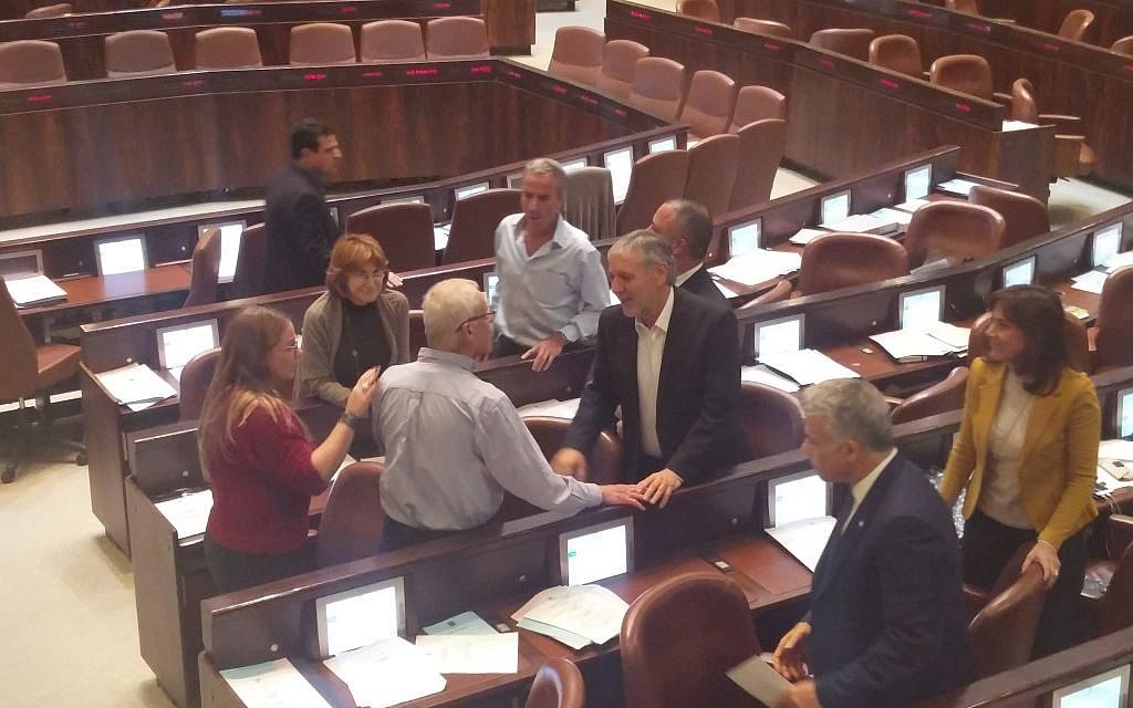MK Benny Begin, in blue shirt,  being surrounded by opposition MKs in the Knesset on December 7, 2016. (Raould Wootliff/Times of Israel)