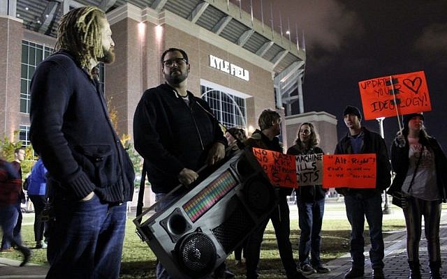 A man holding a large boombox blasts Dr. Martin Luther King's 'I have a dream' at a demonstration at Texas A&M University against Richard Spencer, December 6, 2016. (Ricky Ben-David/Times of Israel) A man holding a large boombox blasts Dr. Martin Luther King's 'I have a dream' at a demonstration at Texas A&M University against Richard Spencer, December 6, 2016. (Ricky Ben-David/Times of Israel)