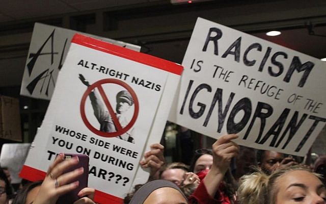 Protesters hold up signs at a demonstration againt Richard Spencer, a leader of the so-called alt-right movement, at Texas A&M University on December 6, 2016. (Ricky Ben-David/Times of Israel) Protesters hold up signs at a demonstration againt Richard Spencer, a leader of the so-called alt-right movement, at Texas A&M University on December 6, 2016. (Ricky Ben-David/Times of Israel)