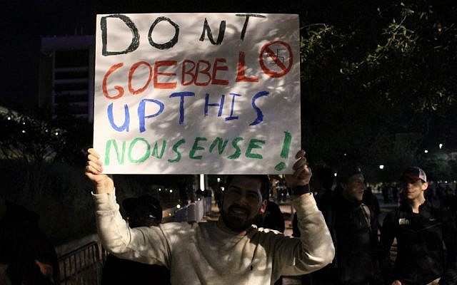 A protester holds up a sign at a demonstration againt Richard Spencer, a leader of the so-called alt-right movement, at Texas A&M University on December 6, 2016. (Ricky Ben-David/Times of Israel) A protester holds up a sign at a demonstration againt Richard Spencer, a leader of the so-called alt-right movement, at Texas A&M University on December 6, 2016. (Ricky Ben-David/Times of Israel)