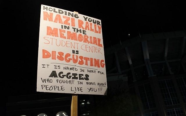 A protester holds up a sign at a demonstration againt Richard Spencer, a leader of the so-called alt-right movement, at Texas A&M University on December 6, 2016. (Ricky Ben-David/Times of Israel) A protester holds up a sign at a demonstration againt Richard Spencer, a leader of the so-called alt-right movement, at Texas A&M University on December 6, 2016. (Ricky Ben-David/Times of Israel)