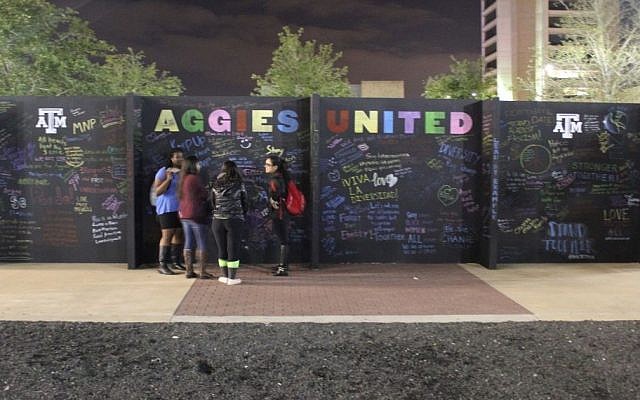 Students write messages of unity on a protest wall at Texas A&M University where hundreds were protesting a speech given by a self-styled leader of the so-called alt-right movement. (Ricky Ben-David/Times of Israel) Students write messages of unity on a protest wall at Texas A&M University where hundreds were protesting a speech given by a self-styled leader of the so-called alt-right movement. (Ricky Ben-David/Times of Israel)