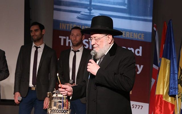 Rabbi Lau opens the International Conference of Jewish Educators at Yad Vashem by lighting a Hanukkah menorah from Krakow, Poland, on December 26, 2016. (Yad Vashem/Isaac Harari) Rabbi Lau opens the International Conference of Jewish Educators at Yad Vashem by lighting a Hanukkah menorah from Krakow, Poland, on December 26, 2016. (Yad Vashem/Isaac Harari)