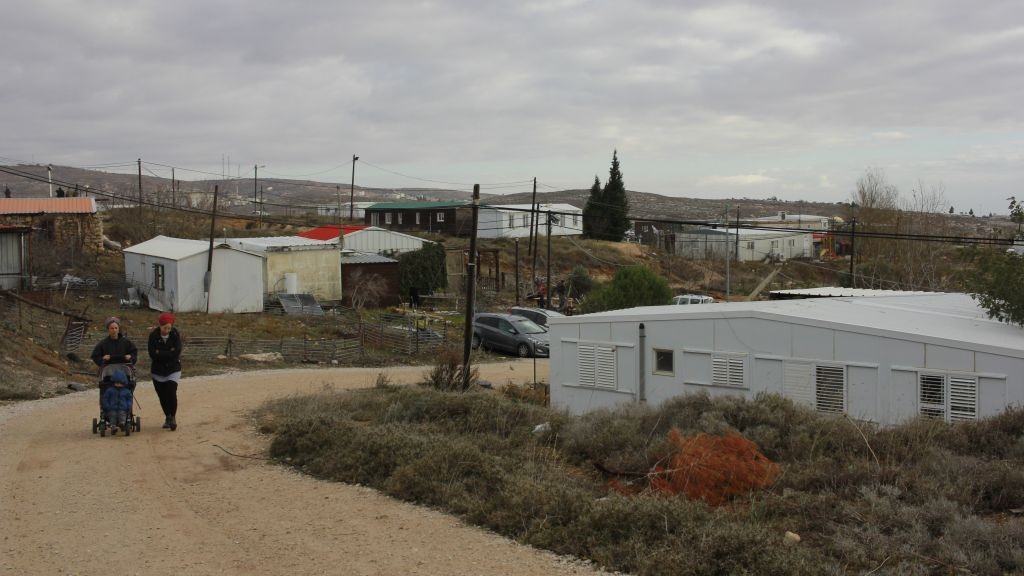 Women walking in the Amona outpost on December 15, 2016. Protesters began gathering earlier in the day at the outpost ahead of a court-ordered evacuation. (Judah Ari Gross/Times of Israel) Women walking in the Amona outpost on December 15, 2016. Protesters began gathering earlier in the day at the outpost ahead of a court-ordered evacuation. (Judah Ari Gross/Times of Israel)