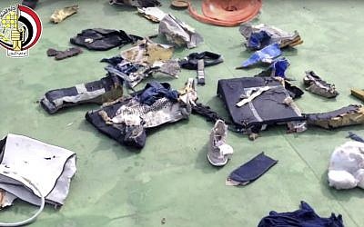 This still file image taken from video posted Saturday, May 21, 2016, on the official Facebook page of the Egyptian Armed Forces spokesman shows some personal belongings and other wreckage from EgyptAir flight 804 (Egyptian Armed Forces via AP)