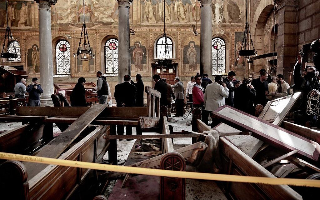 Security forces examine the scene inside the St. Mark Cathedral in central Cairo, following a bombing, Sunday, December 11, 2016. (AP/Nariman El-Mofty)