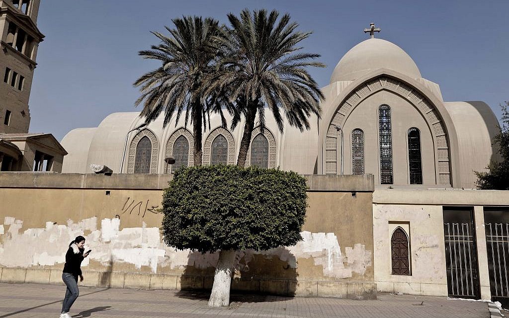 A Coptic christian woman cries as she speaks on her mobile phone outside St. Mark Cathedral in central Cairo, following a bombing, Sunday, December 11, 2016. (AP/Nariman El-Mofty)