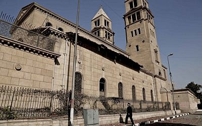 A policeman inspects damages outside the St. Mark Cathedral in central Cairo, following a bombing, Sunday, Dec. 11, 2016. (AP Photo/Nariman El-Mofty)