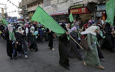 Palestinian Hamas supporters hold green Islamic flags during a rally to commemorate the 29th anniversary of the founding of the Hamas militant group, in Gaza City, Wednesday, Dec. 14, 2016. (AP Photo/Adel Hana) Palestinian Hamas supporters hold green Islamic flags during a rally to commemorate the 29th anniversary of the founding of the Hamas militant group, in Gaza City, Wednesday, Dec. 14, 2016. (AP Photo/Adel Hana)