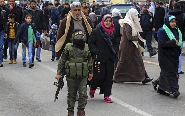 A masked Palestinian boy wears a uniform and holds a toy weapon during a rally to commemorate the 29th anniversary of the founding of Hamas, in Gaza City, Wednesday, Dec. 14, 2016. (AP Photo/Adel Hana) A masked Palestinian boy wears a uniform and holds a toy weapon during a rally to commemorate the 29th anniversary of the founding of Hamas, in Gaza City, Wednesday, Dec. 14, 2016. (AP Photo/Adel Hana)